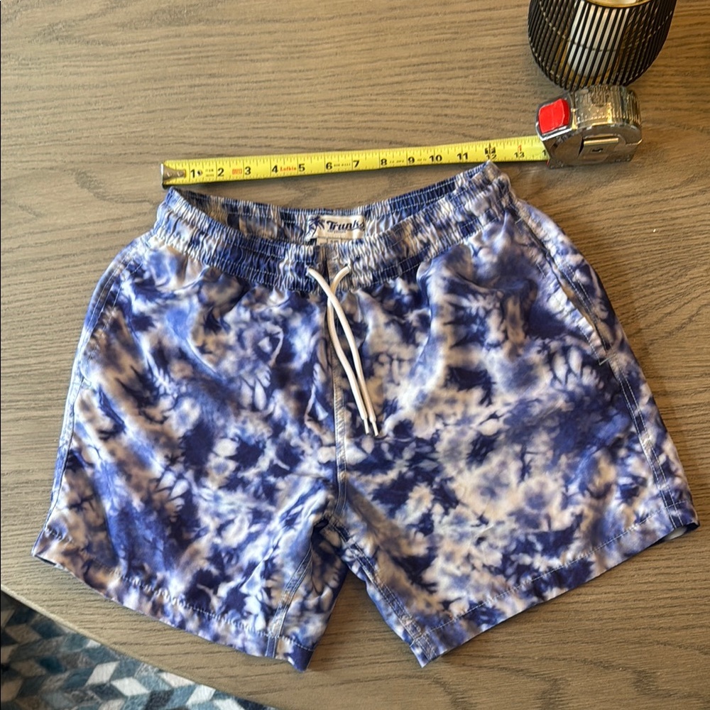 Trunks Surf & Swim Co blue-purple and White Swim Trunks Ocean-Inspired Design.